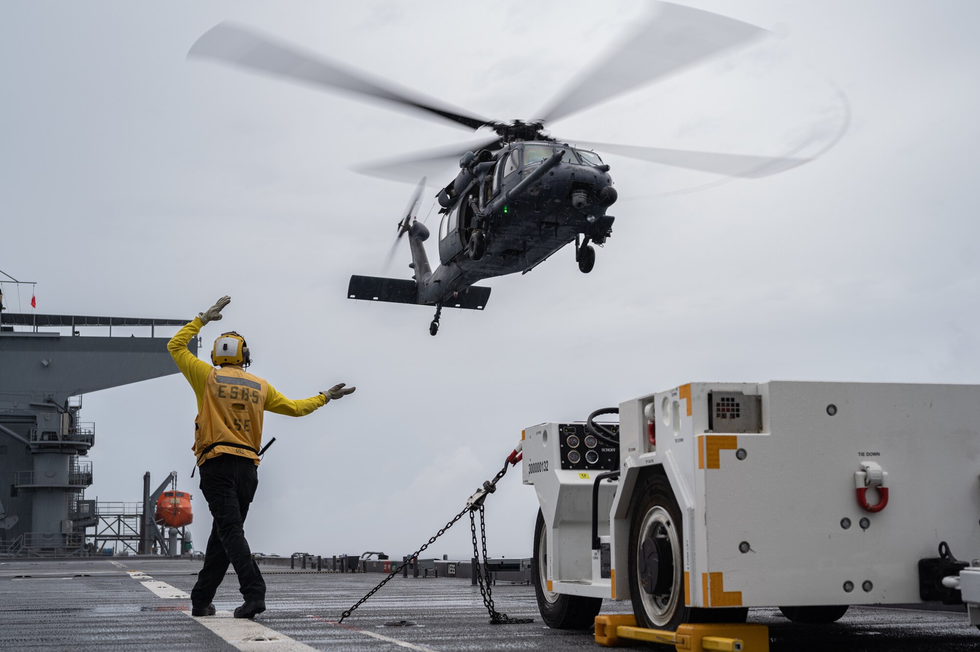 Sailor directs helicopter.