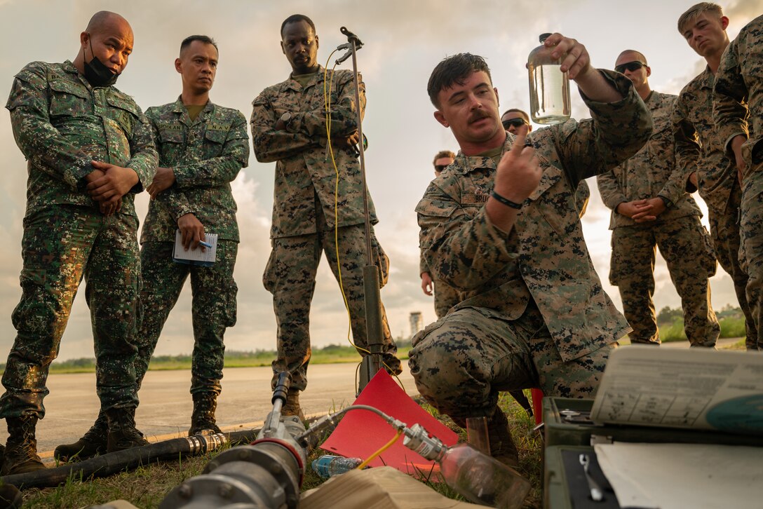 U.S. Marines with Combat Logistics Regiment 3, 3d Marine Logistics Group, share Forward Arming and Refueling Point knowledge with members of the Armed Forces of the Philippines during Marine Aviation Support Activity 22.1 in Luzon, Philippines, June 7, 2022. MASA 22 is a bilateral exercise between the Armed Forces of the Philippines and the U.S. Marine Corps, aimed at increasing interoperability and improving aviation-related capabilities in support of U.S.-Philippine mutual defense. (U.S. Marine Corps photo by Cpl. Ujian Gosun)