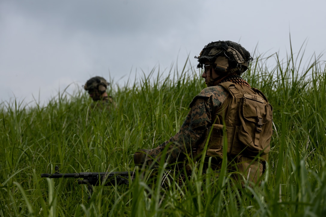 U.S. Marines Corps Lance Cpl. Jacob Lee, a machine gunner with 3d Battalion, 2d Marines, patrols during Exercise Shinka 22.1 at Combined Arms Training Center, Camp Fuji, Japan, June 21, 2022. Shinka exemplifies a shared commitment to realistic training that produces lethal, ready, and adaptable forces capable of decentralized operations across a wide range of missions. 3/2 is forward deployed in the Indo-Pacific under 4th Marines, 3d Marine Division as part of the Unit Deployment Program. Lee is a native of Point Pleasant, West Virginia. (U.S. Marine Corps photo by Sgt. Levi J. Guerra)