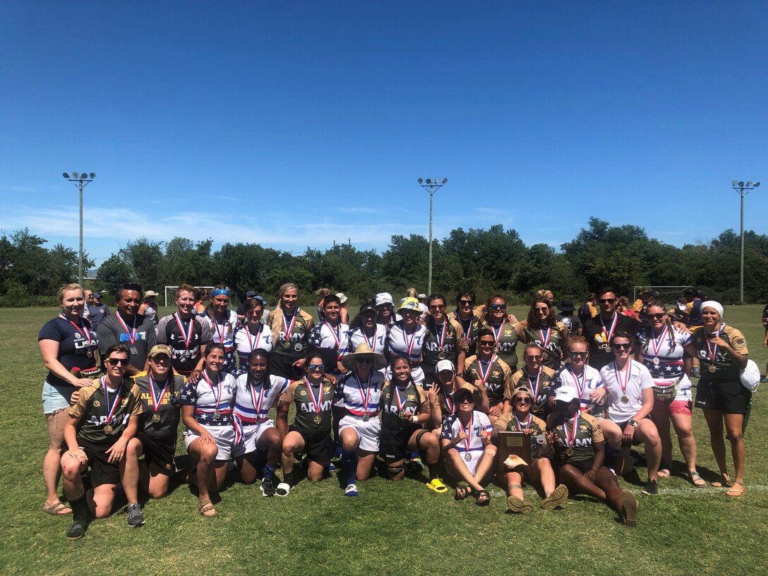 Army and Air Force grouped together with Marines, Navy and Coast Guard players to celebrate their respective gold and silver medals at the 2022 Armed Forces Women's Rugby Championship held in conjunction with the Cape Fear Rugby 7's Tournament in Wilmington, North Carolina.