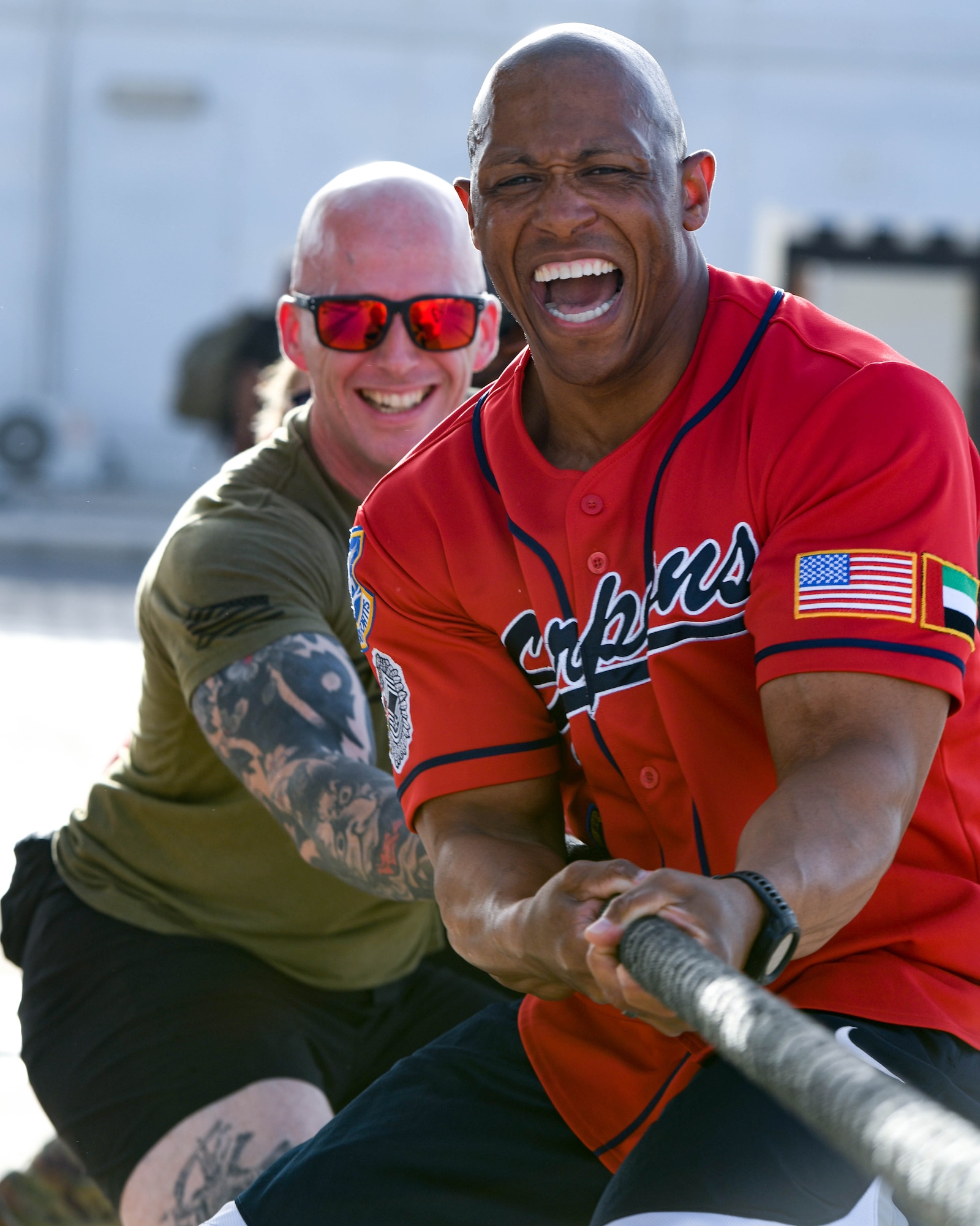 Airmen from the 380th Expeditionary Security Forces Squadron compete in a tug of war challenge during Police Week, May 20, 2022 at Al Dhafra Air Base, United Arab Emirates. In 1962, President John F. Kennedy signed a proclamation which designated May 15th as National Peace Officers Memorial Day, and the week in which it falls as National Police Week. Since the first service memorial gathering in Senate Park, Washington D.C., U.S. agencies across the nation and abroad have held events to honor fallen officers and acknowledge their sacrifices.