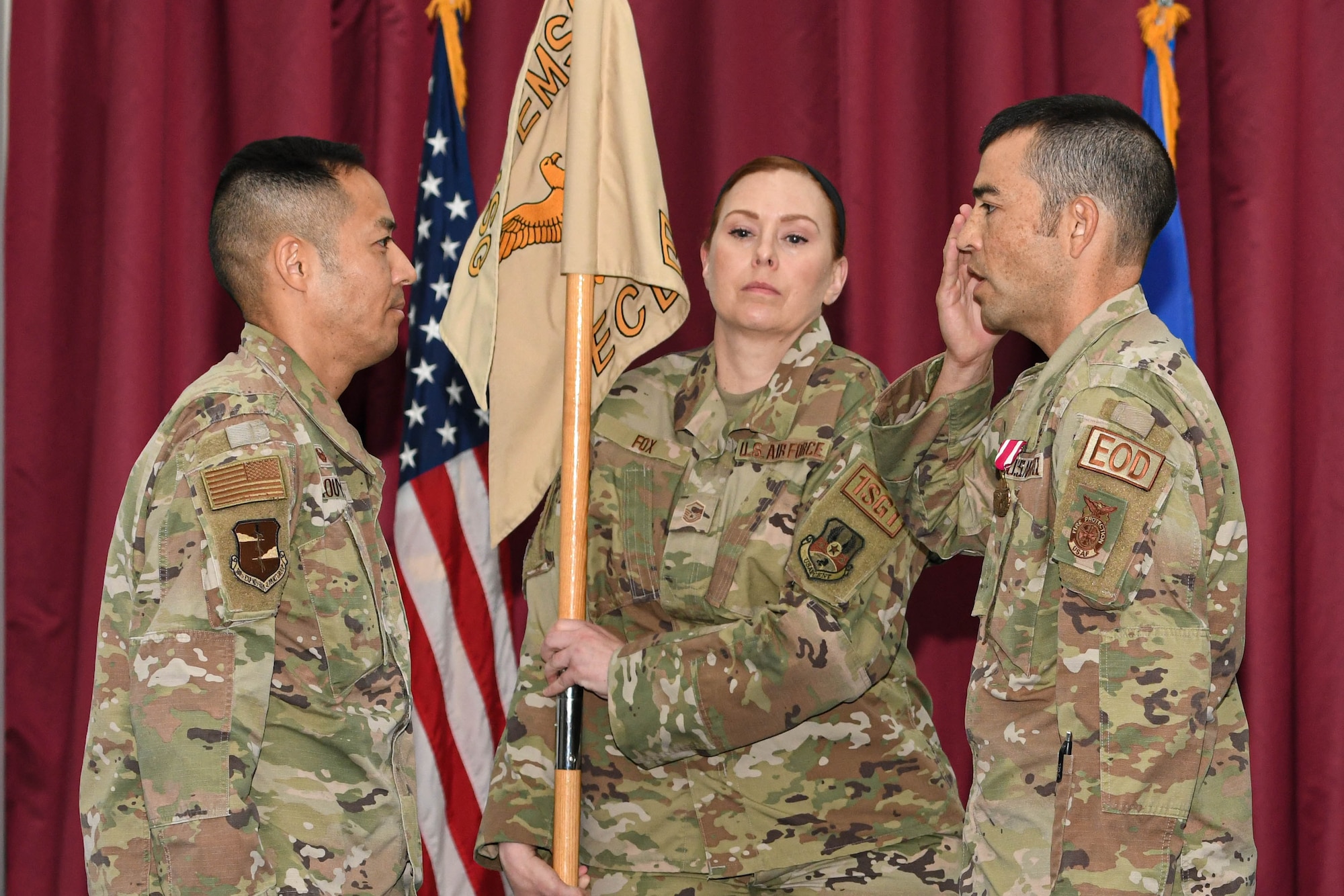 Lt. Col. Brandon Hori, the outgoing commander of the 380th Expeditionary Civil Engineer Squadron, salutes Colonel Todd T. Inouye, the previous 380th Expeditionary Mission Support Group commander and new 380th Air Expeditionary Wing A1/4/6/7 staff director, after relinquishing command of the 380th ECES during a change of command ceremony, May 20, 2022 at Al Dhafra Air Base, United Arab Emirates. Hori led in critical and essential roles at the Wing and squadron levels and served as the wing's emergency operations center director numerous times during exercises and real world emergencies.
