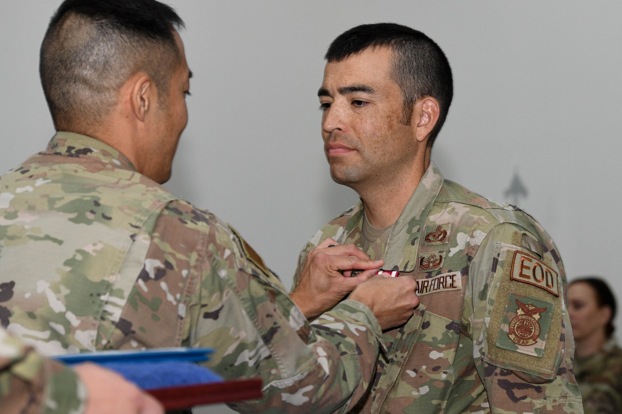Colonel Todd T. Inouye, the previous 380th Expeditionary Mission Support Group commander and new 380th Air Expeditionary Wing A1/4/6/7 staff director, awards Lt. Col. Brandon Hori, the outgoing commander of the 380th Expeditionary Civil Engineer Squadron, the Meritorious Service Medal during a change of command ceremony, May 20, 2022 at the Phantom Center, Al Dhafra Air Base, United Arab Emirates. Hori led in critical and essential roles at the Wing and squadron levels and served as the wing's emergency operations center director numerous times during exercises and real world emergencies.