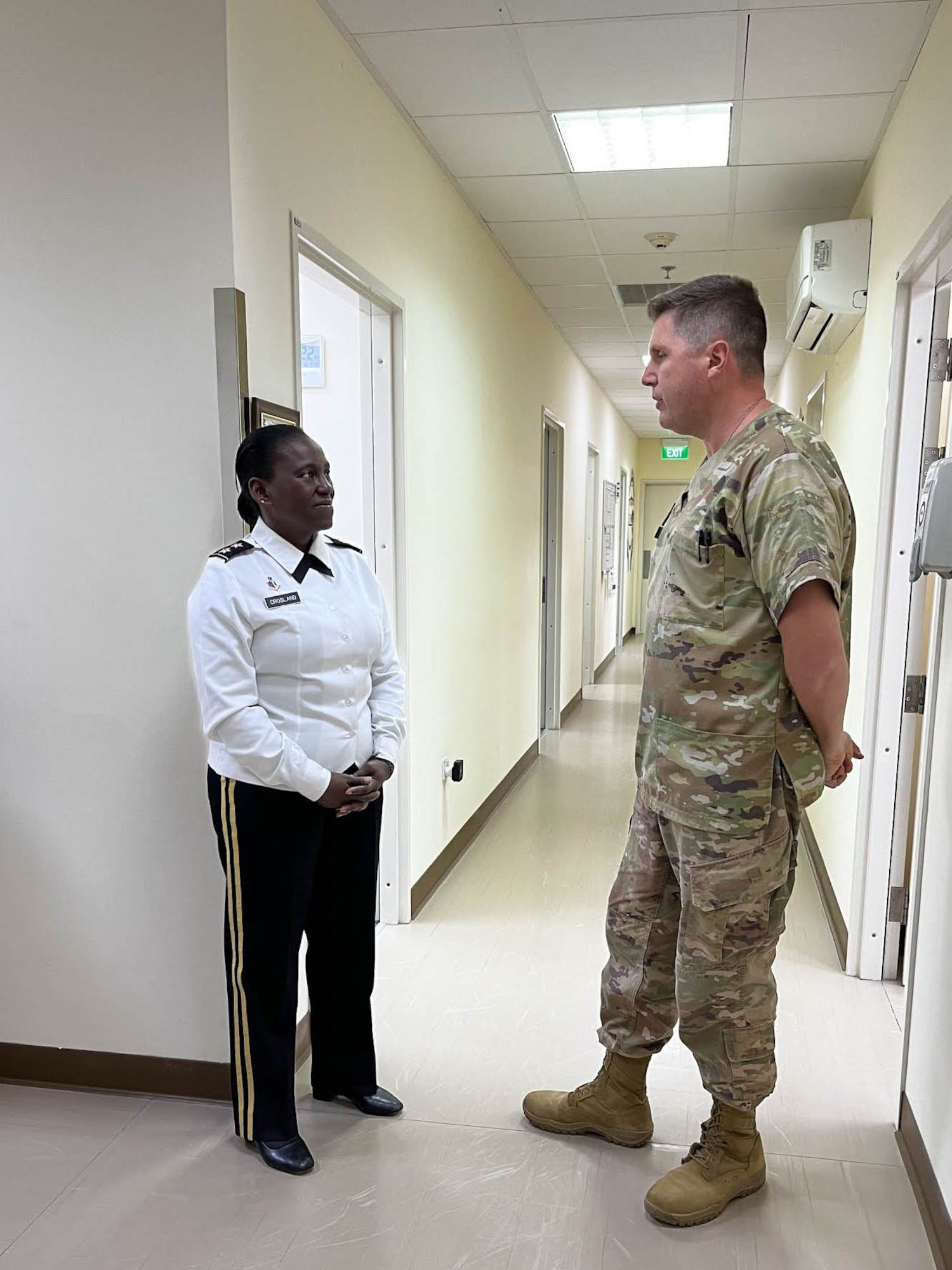 U.S. Army Maj. Gen. Telita Crosland, the Army Deputy Surgeon General, speaks with an Airman from the 380th Expeditionary Medical Group, May 16, 2022 during a visit at Al Dhafra Air Base, United Arab Emirates. The intent of Crosland’s visit was to assess the progress of the joint, multi-national Trauma, Burn and Rehabilitative Medicine program.