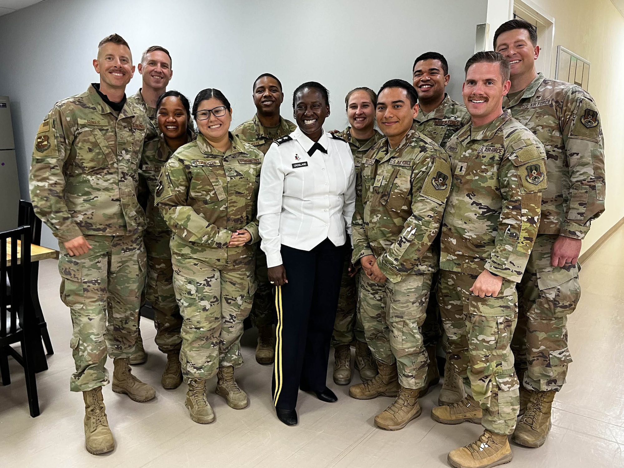 Maj. Gen. Telita Crosland, the U. S. Army Deputy Surgeon General, poses for a photo with Airmen assigned to the 380th Expeditionary Medical Group, May 16, 2022 at Al Dhafra Air Base, United Arab Emirates. The intent of Crosland’s visit was to assess the progress of the joint, multi-national Trauma, Burn and Rehabilitative Medicine program.