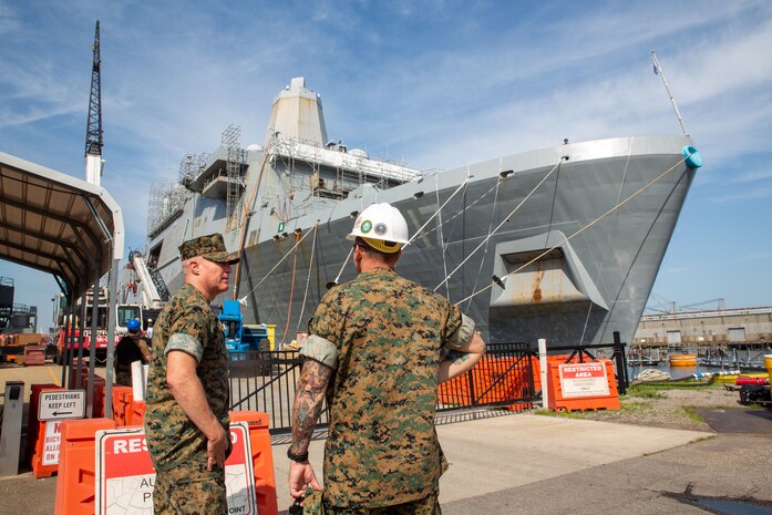 U.S. Marine Corps Sgt. Maj. Michael J. Pritchard, the command sergeant major of Fleet Marine Force, Atlantic (FMFLANT), Marine Forces Command (MARFORCOM), Marine Forces Northern Command (MARFOR NORTHCOM), and U.S. Navy Master Chief Jeffery A. Barnes, the command master chief of FMFLANT, MARFORCOM, MARFOR NORTHCOM, observe the hull of the USS San Antonio (LPD 17) during a scheduled tour at Marine Hydraulics International, Virginia, June 17, 2022. The USS San Antonio is moored at Marine Hydraulics International after a successful deployment for ship upgrades and repairs. The tour aboard the USS San Antonio allowed higher echelon leadership a better understanding of ship capabilities, personnel well-being and lethality of joint force operations. (U.S. Marine Corps photo by Sgt. Kealii De Los Santos)