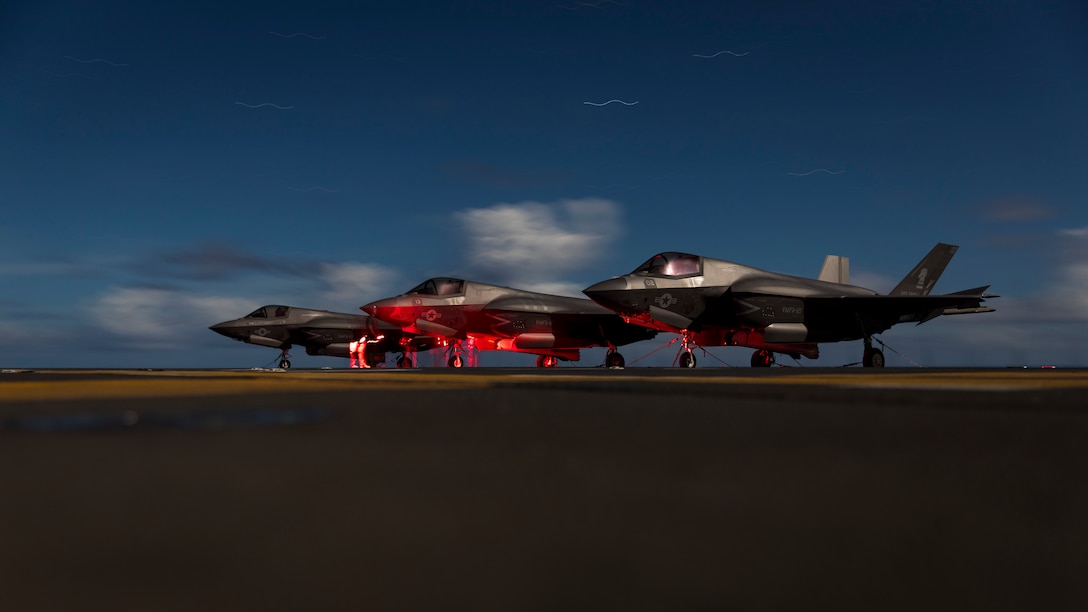 U.S. Marines with Marine Fighter Attack Squadron 121 conduct maintenance on F-35B Lightning II aircraft while underway aboard the amphibious assault carrier USS Tripoli, June 13, 2022. Marines with VMFA-121, based out of Marine Corps Air Station Iwakuni, Japan, are conducting flight operations in support of a free and open Indo-Pacific.