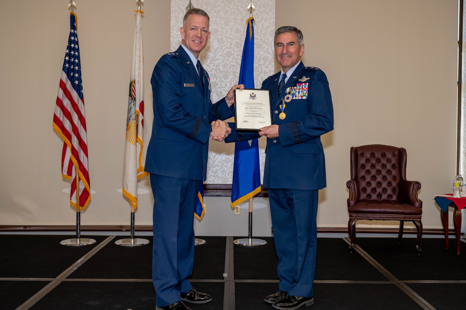 Maj. Gen. Peter Nezamis is presented with a certificate of retirement by Maj. Gen. Rich Neely, the Adjutant General of Illinois and Commander of the Illinois National Guard, during a retirement ceremony June 17 at the 126th Air Refueling Wing, based at Scott Air Base, Belleville, Illinois.