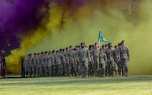 group of soldiers marching across a field