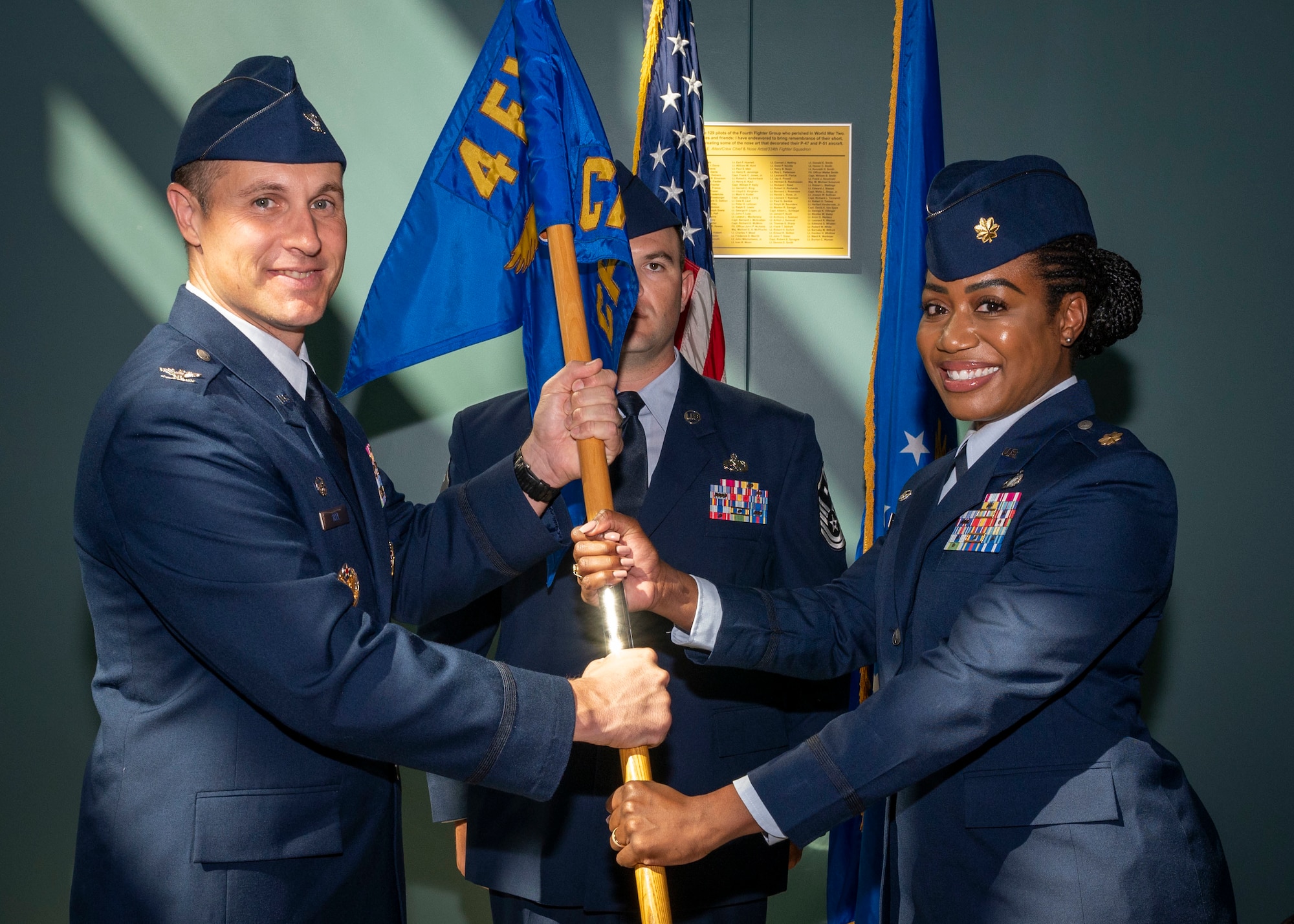 Maj. Aleksi Vega, right, incoming 4th Comptroller Squadron commander, receives the guidon from Col. Lucas Teel, 4th Fighter Wing commander, during the 4th CPTS change of command ceremony at Seymour Johnson Air Force Base, North Carolina, June 24, 2022.