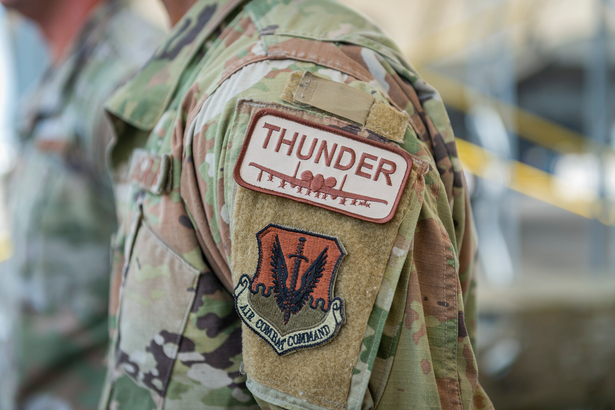 Photo of an Airman wearing a thunder patch