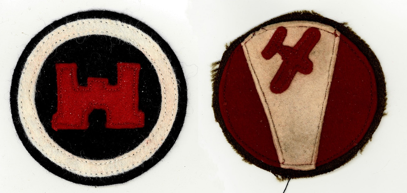 Two crude cloth badges