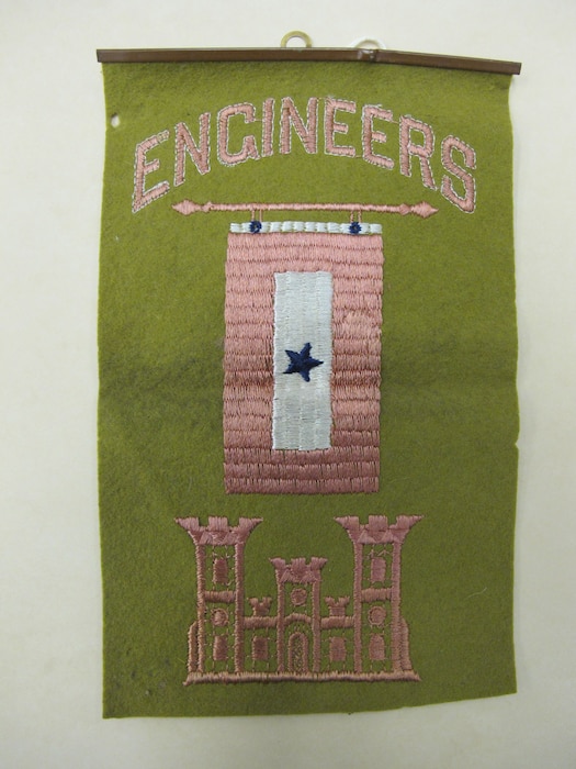 Vertical banner with a blue star and a castle logo