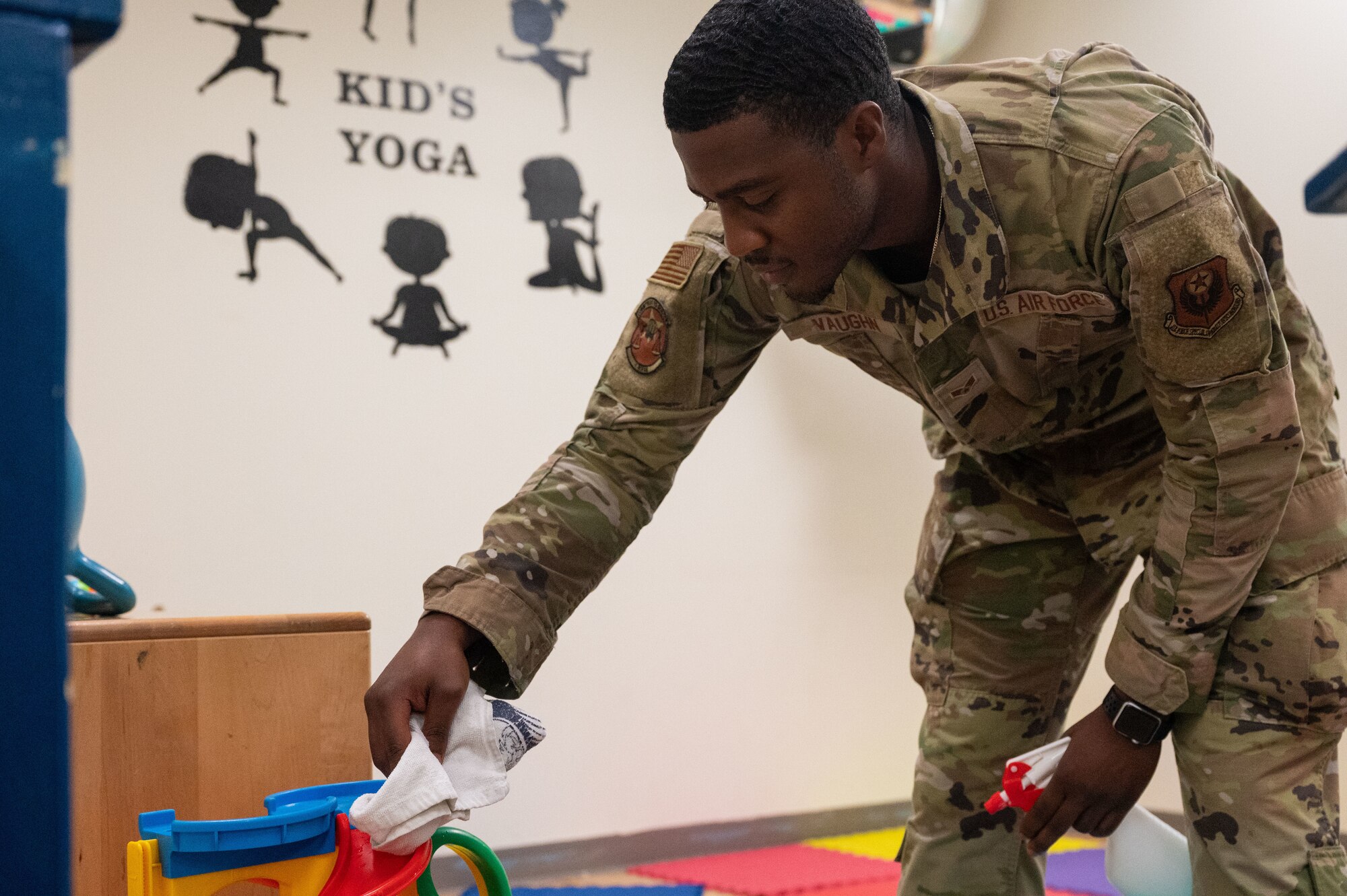 U.S. Air Force Senior Airman Richard Vaughn, a 1st Special Operations Force Support Squadron fitness center apprentice, cleans toys at Hurlburt Field, Florida, June 16, 2022.