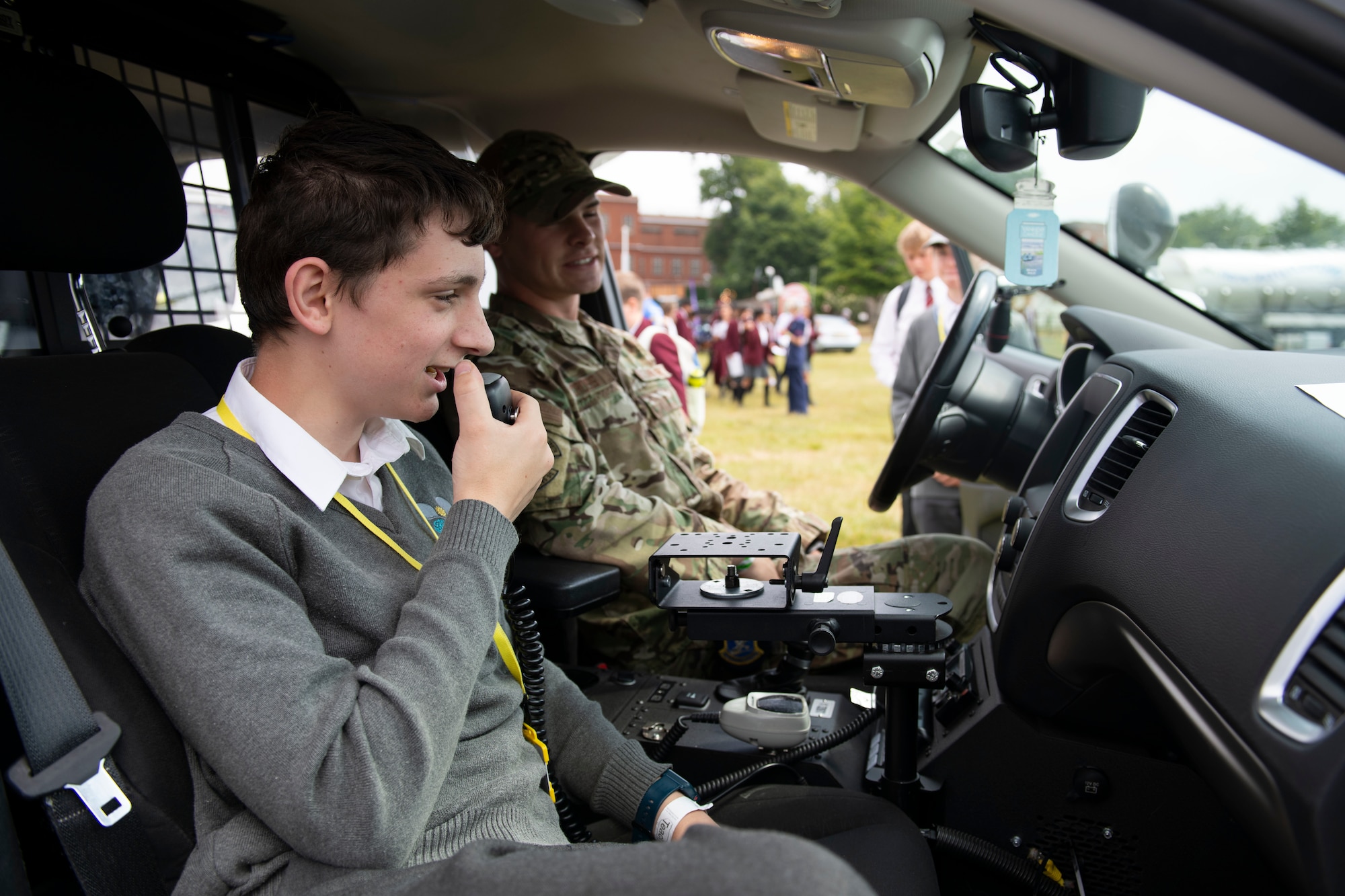 U.S. Air Force 423rd Security Forces Defenders from Royal Air Force Alconbury and Molesworth, engage with attendees during the Cambridgeshire County Day at the Newmarket July Course, England, June 23, 2022. The County Day was an opportunity to celebrate Cambridgeshire and Her Majesty The Queen’s Platinum Jubilee. (U.S. Air Force photo by Senior Airman Jennifer Zima)