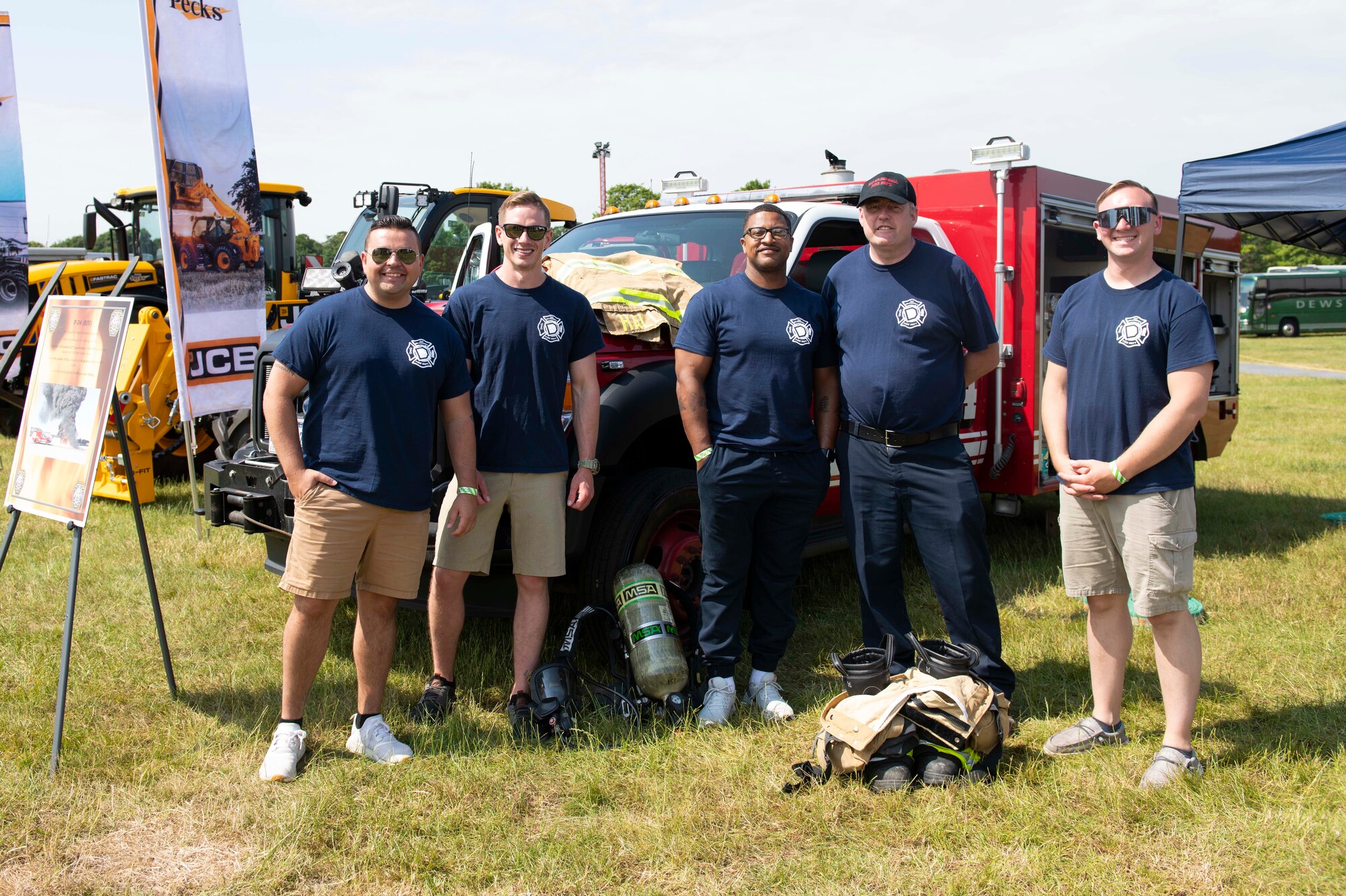 U.S. Air Force 100th Civil Engineer Squadron firefighters from RAF Mildenhall, engage with attendees during the Cambridgeshire County Day at the Newmarket July Course, England, June 23, 2022. The County Day was an opportunity to celebrate Cambridgeshire and Her Majesty The Queen’s Platinum Jubilee. (U.S. Air Force photo by Senior Airman Jennifer Zima)