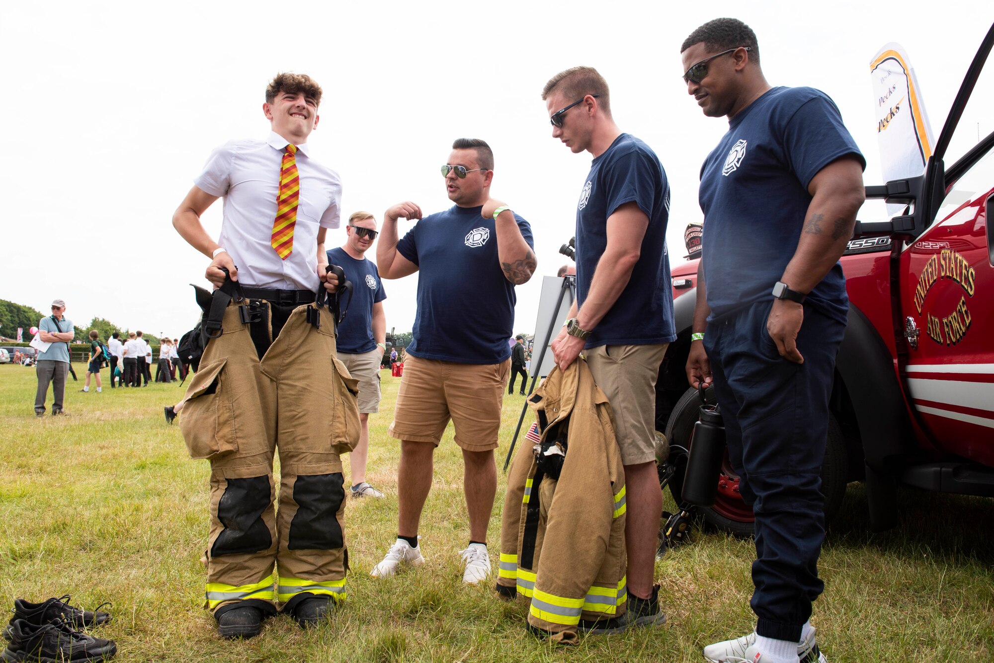 U.S. Air Force 100th Civil Engineer Squadron firefighters from RAF Mildenhall, engage with attendees during the Cambridgeshire County Day at the Newmarket July Course, England, June 23, 2022. The County Day was an opportunity to celebrate Cambridgeshire and Her Majesty The Queen’s Platinum Jubilee. (U.S. Air Force photo by Senior Airman Jennifer Zima)