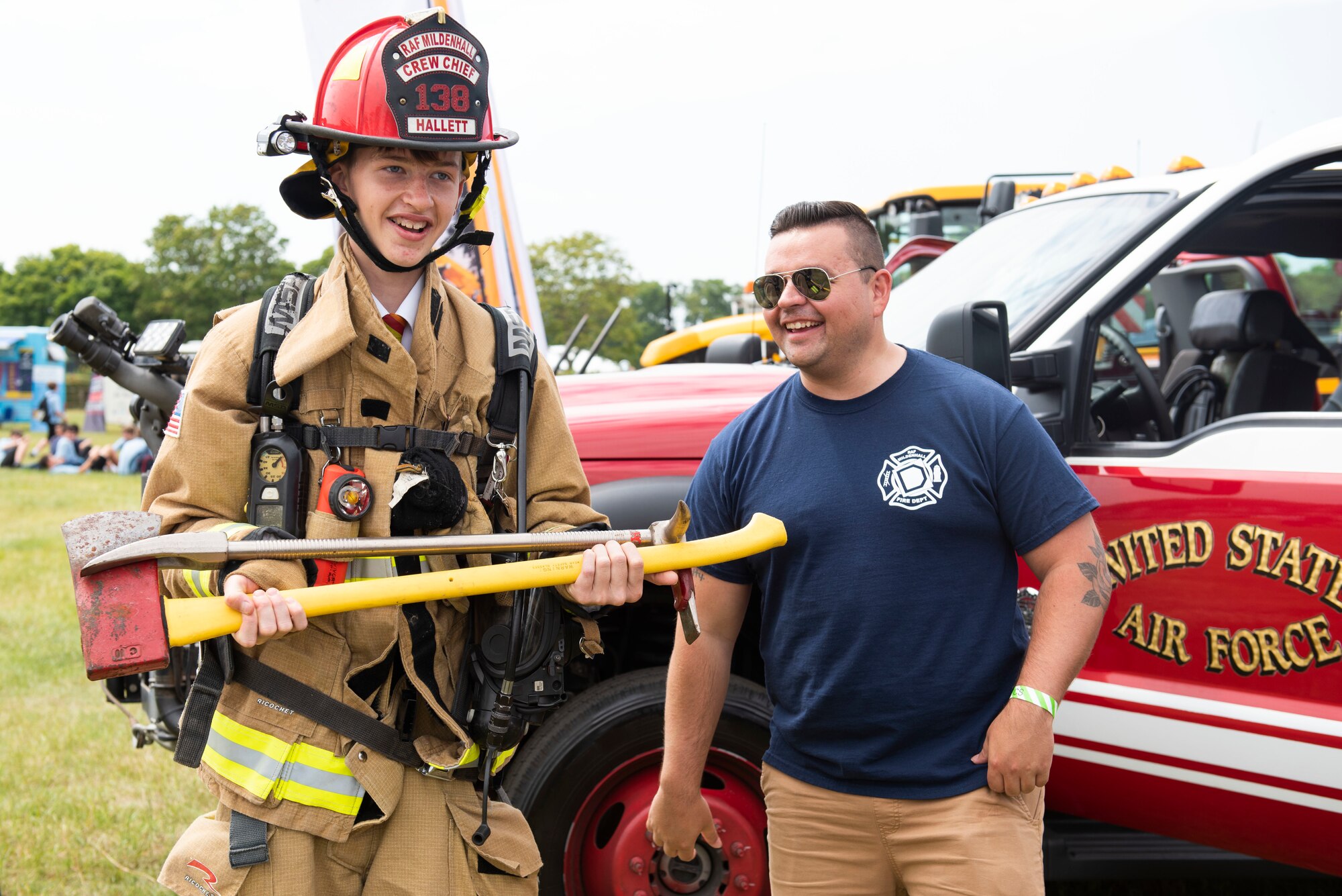 U.S. Air Force 100th Civil Engineer Squadron firefighters from RAF Mildenhall, engage with attendees during the Cambridgeshire County Day at the Newmarket July Course, England, June 23, 2022. The County Day was an opportunity to celebrate Cambridgeshire and Her Majesty The Queen’s Platinum Jubilee. (U.S. Air Force photo by Senior Airman Jennifer Zima)