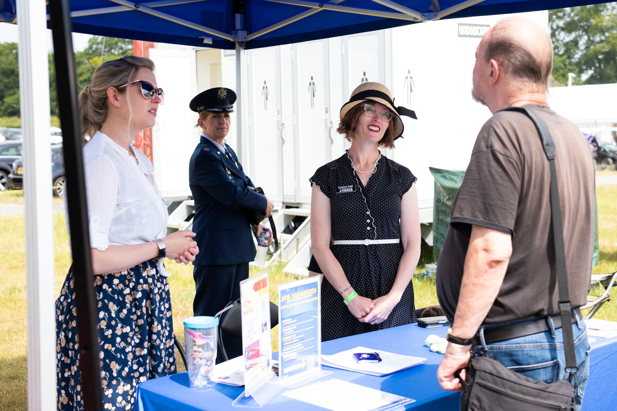 U.S. Air Force 423rd Force Support Squadron staff from Royal Air Force Alconbury, engage with attendees during the Cambridgeshire County Day at the Newmarket July Course, England, June 23, 2022. The County Day was an opportunity to celebrate Cambridgeshire and Her Majesty The Queen’s Platinum Jubilee. (U.S. Air Force photo by Senior Airman Jennifer Zima)