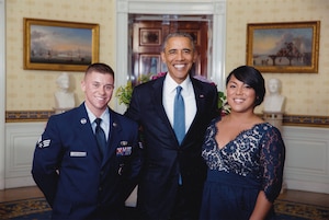 Then-Senior Airman Logan Ireland, Air Force Office of Special Investigations, Field Investigation Squadron 5, Detachment 611, special agent poses with former President Barrack Obama and Ireland’s wife, Laila Ireland, at the White House, in Washington, D.C. (Courtesy photo)
