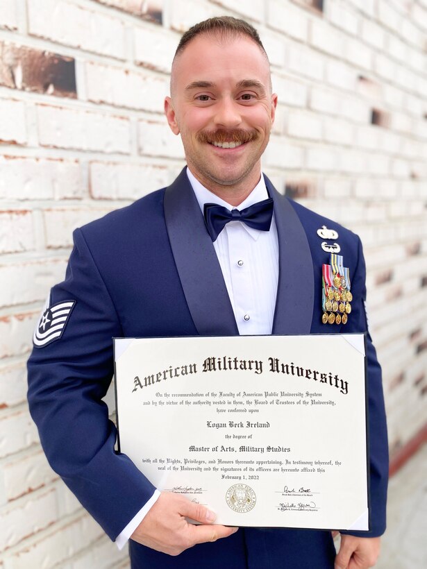 Tech. Sgt. Logan Ireland, Air Force Office of Special Investigations, Field Investigation Squadron 5, Detachment 611, special agent, poses for a photo upon receiving his Master of Arts in Military Studies from American Military University. (Courtesy photo)
