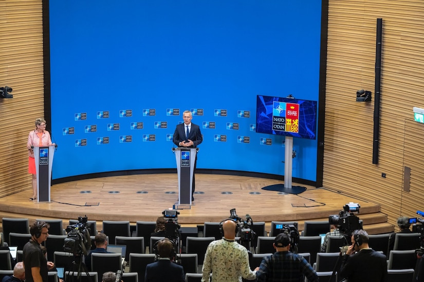 NATO Secretary General Jens Stoltenberg speaks at a lectern.