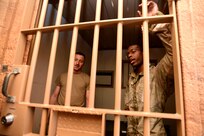 U.S. Army Reserve Soldiers wait in a general population cell, as role-players, in a Theater Detention Facility during the Spartan Warrior Three Training Exercise, June 19, 2022 on Fort McCoy, Wisconsin.