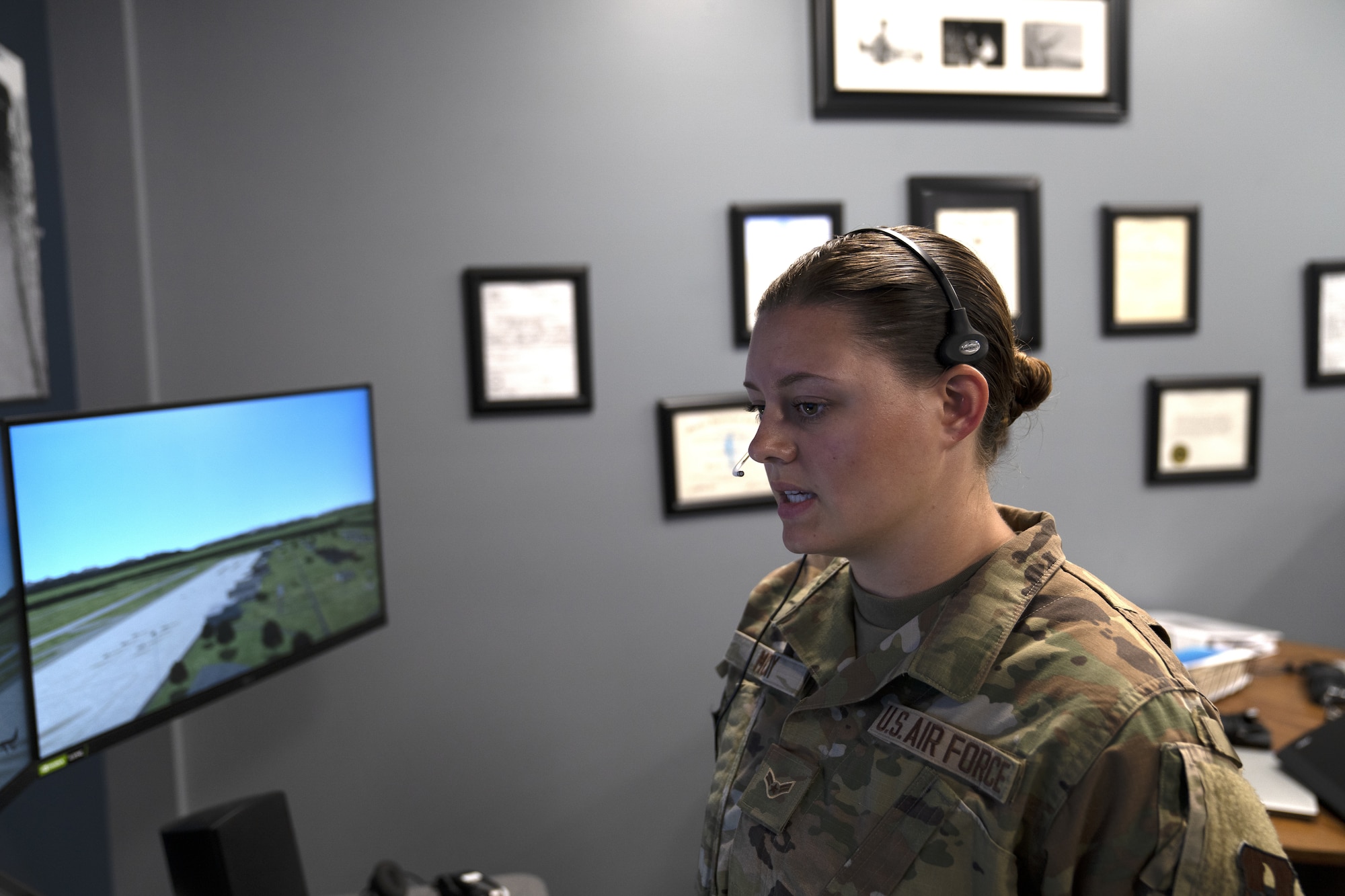 U.S. Air Force Airman 1st Class Shelley McCoy, 334th Training Squadron student, uses a condensed air traffic control tower simulator for training at Cody Hall at Keesler Air Force Base, Mississippi, June 2, 2022. A similar system has been installed in the dorm building to allow students the opportunity to increase tower control contact hours and to provide students additional study time outside the classroom.