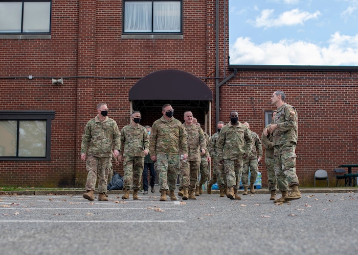 Service members walking together in discussion