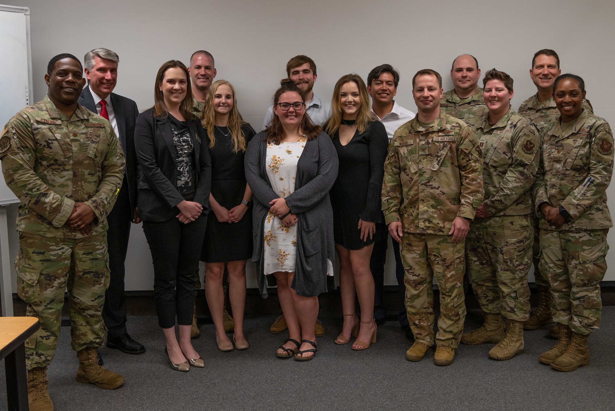 University of Central Missouri students and Whiteman Air Force Base members pose for a group shot at the University of Central Missouri, Missouri, April 29, 2022. The group shot was taken after a new Ozark Dining facility design meant to bring a fresh and welcoming environment for any Airmen who eat there.