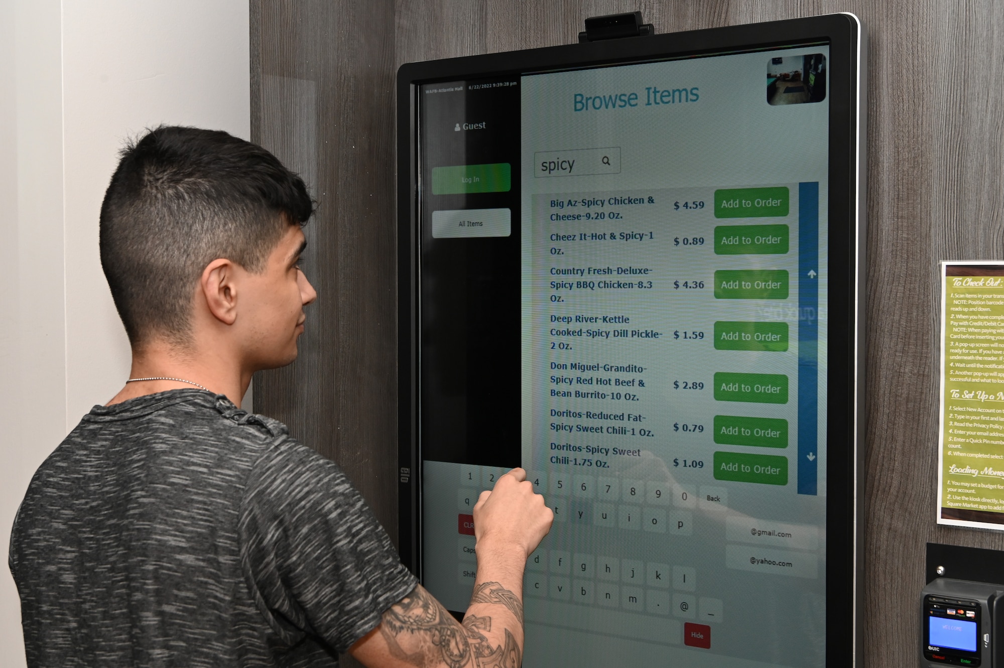 An Atlantis dorm Airman makes his purchases at the mini-market at the Atlantis dorm on Whiteman Air Force Base, Missouri, June 22, 2022. The mini-market is meant to bring the base shoppette to dorm Airmen who have swing shifts or are just needing a late night snack.