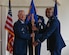 Maj. Trivendhiran Pillai, right, accepts command of the 316th Comptroller Squadron from Col. Tyler Schaff, 316th Wing and  installation commander, during a change of command ceremony at Joint Base Andrews, Md., June 27, 2022.