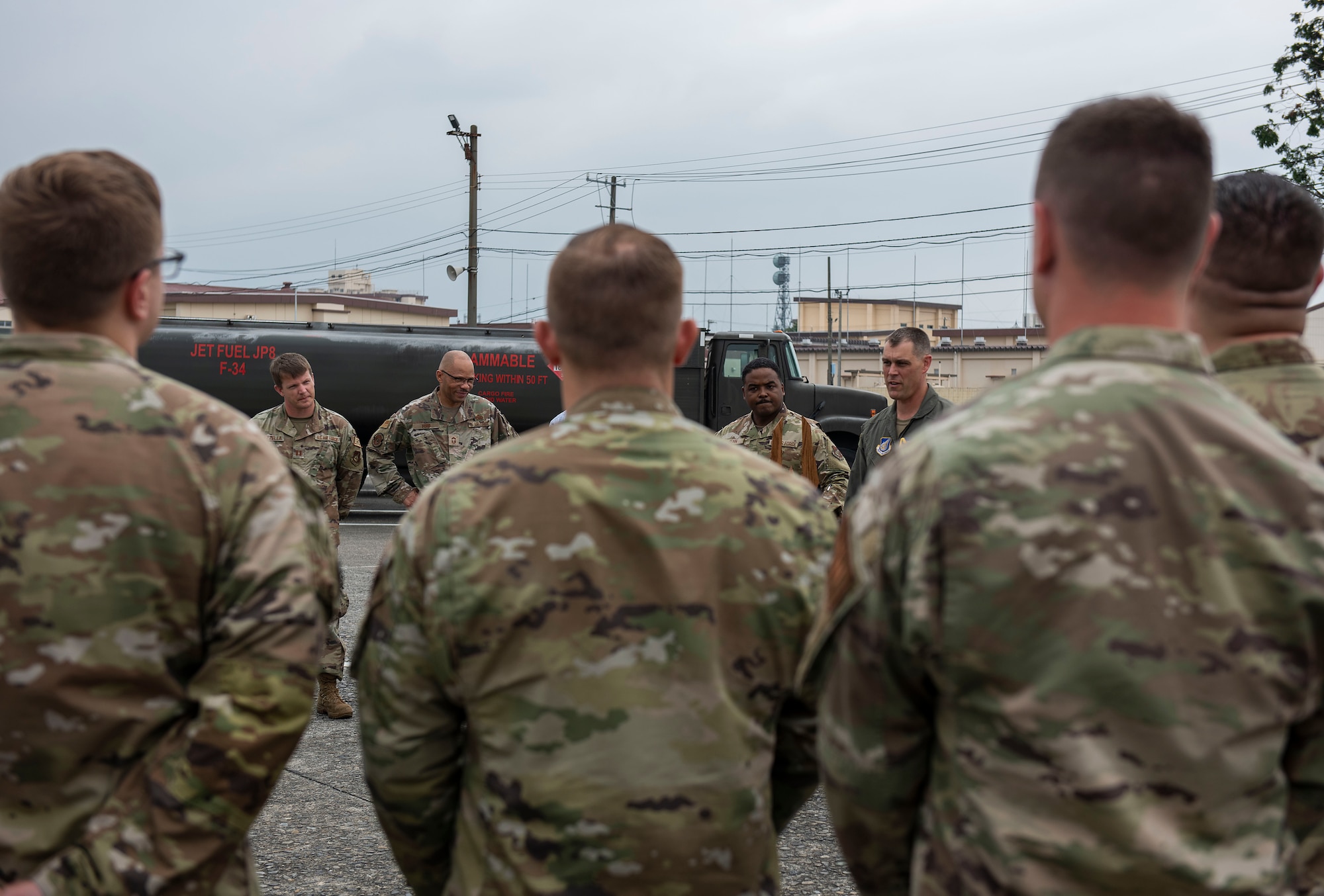 374th Airlift Wing commander congratulates members of the 374th Logistics Readiness Squadron Fuels Management Flight