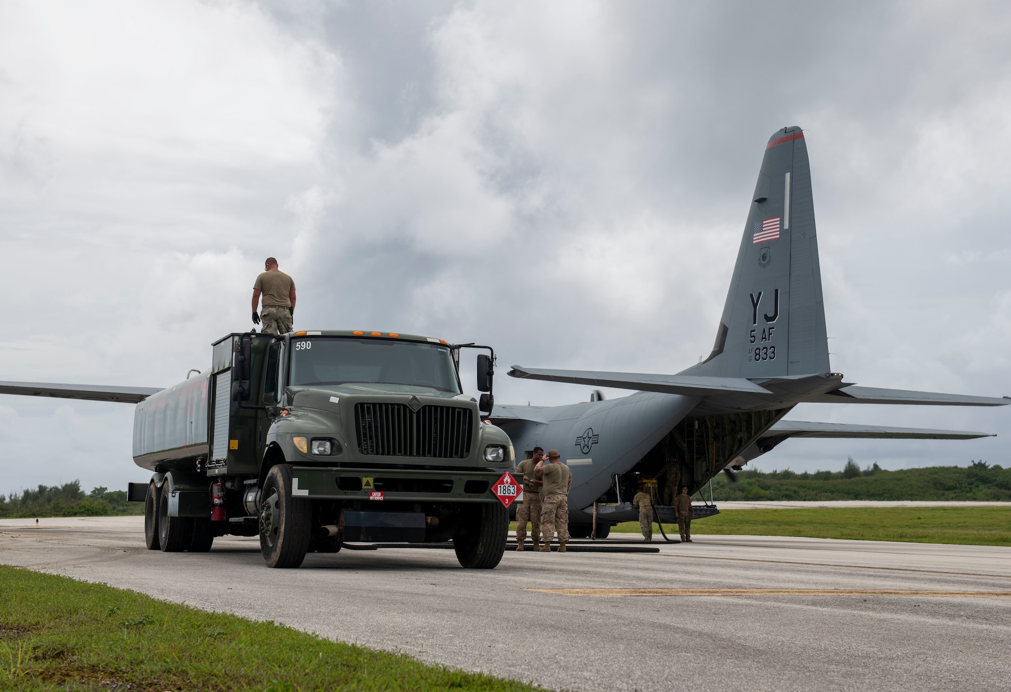 U.S. Air Force Airmen off-load fuel from a C-130J Super Hercules