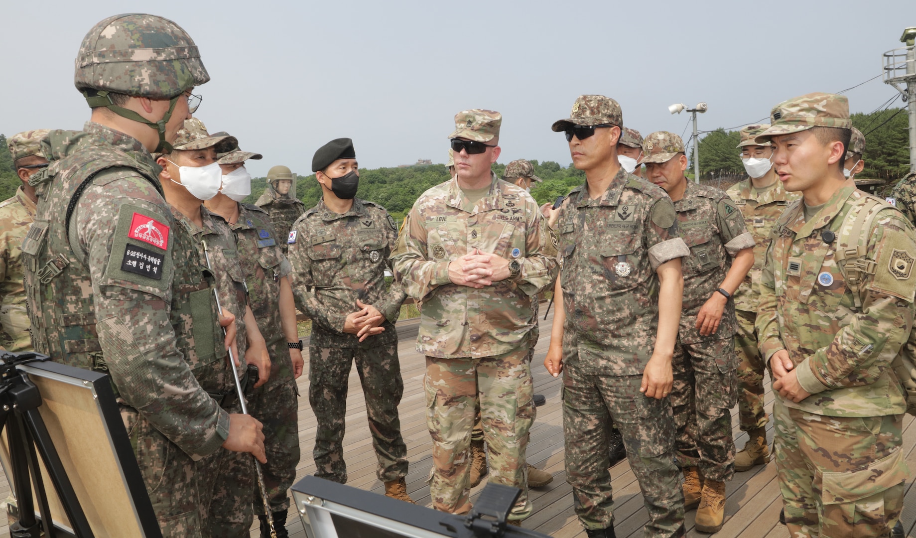 A Republic of Korea Army Major briefs a group of ROK-US Alliance command senior enlisted leaders on remains recovery site at Arrow Head Ridge 281, South Korea, June 22, 2022.