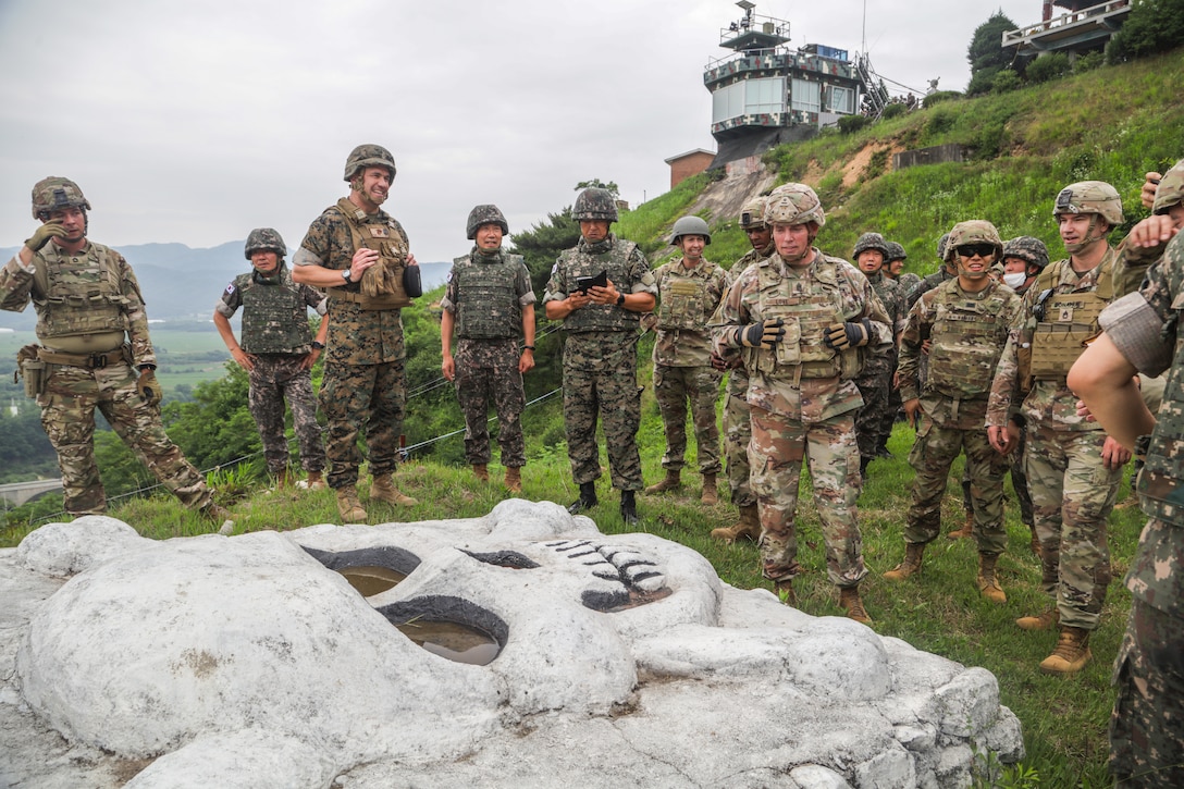 Command senior enlisted leaders with the ROK-US Alliance gather around the Republic of Korea 3rd Infantry Division's iconic White Skull at South Korea, June 23, 2022.