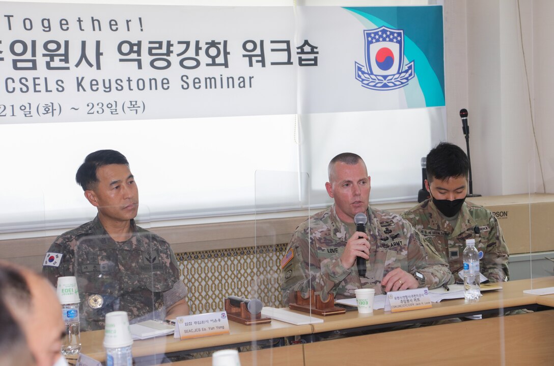 Command Sgt. Maj. Yun-yong Eo, senior enlisted advisor to the Republic of Korea Chairman of the Joint Chiefs of Staff, and Command Sgt. Maj. Jack H. Love, command senior enlisted leader for United Nations Command, Combined Forces Command, and U.S. Forces Korea, participate in a forum discussing the roles of each ROK military branch in developing service members and noncommissioned officers.