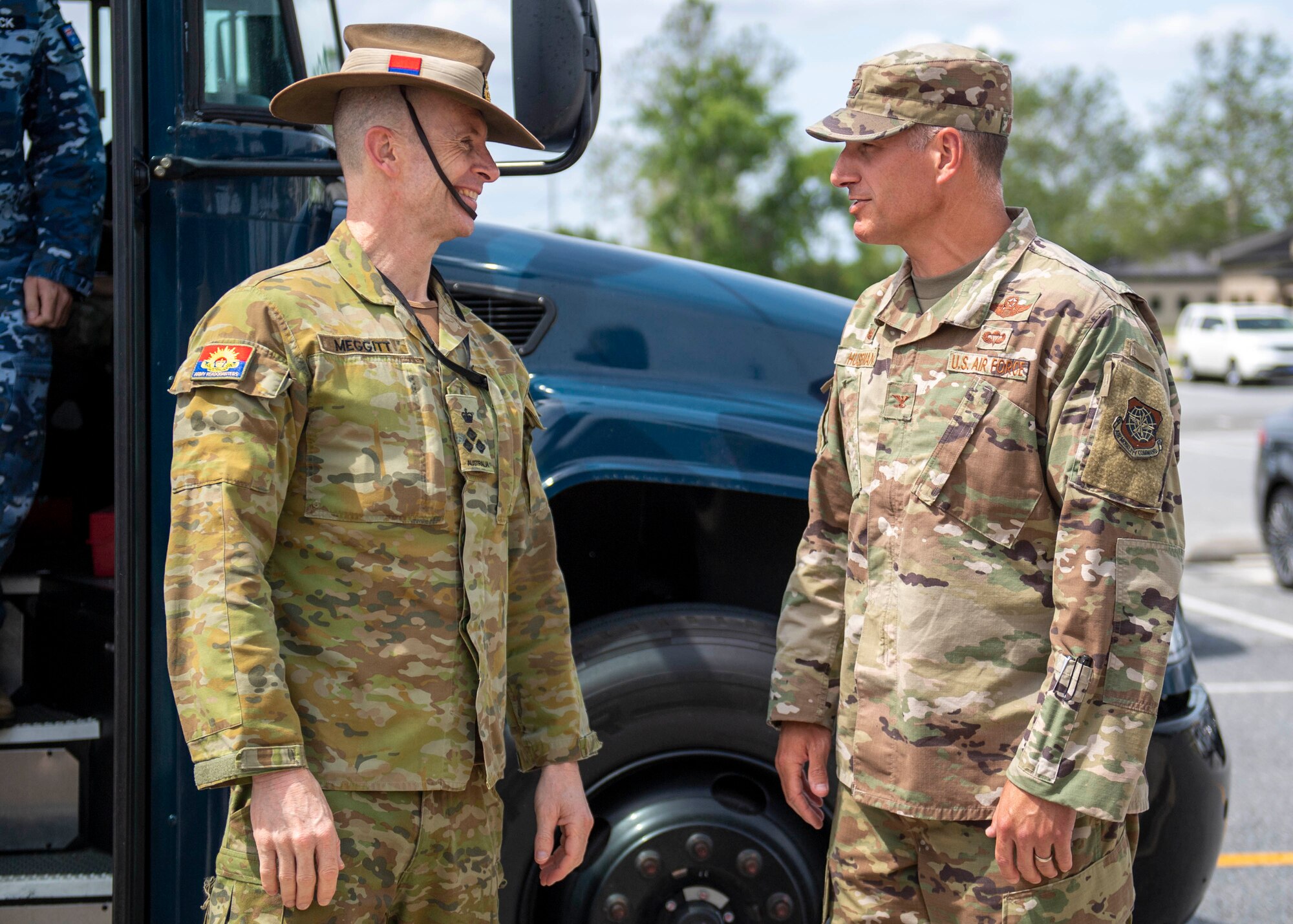 Col. Matt Husemann, right, 436th Airlift Wing commander, greets Australian Army Brigadier Hugh Meggitt, Military Attaché – Washington, during a foreign military sales mission at Dover Air Force Base, Delaware, June 7, 2022. The U.S. and Australia maintain a robust relationship that serves as an anchor for peace and stability in the Indo-Pacific region and around the world. Due to its strategic location, Dover AFB supports approximately $3.5 billion worth of foreign military sales annually. (U.S. Air Force photo by Tech. Sgt. J.D. Strong II)