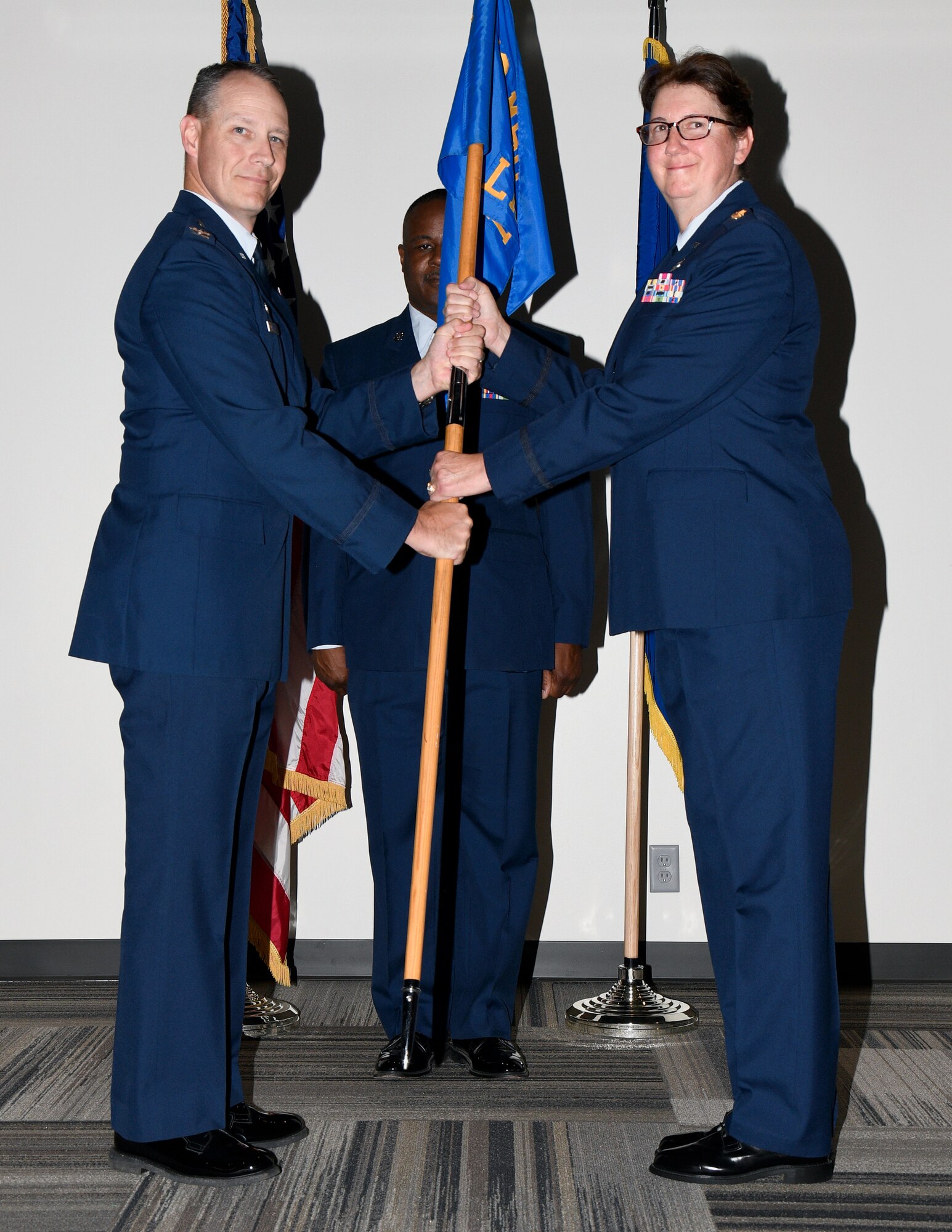 a person accepts the guidon of command from another person.