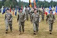 From left to right: Lt. Col. Rebecca Milkowski-Gerdelman, Col. Brad Bane, Lt. Col. Denny Bernacki and Master Sgt. Randolph Leyba march across the parade field during the Army Field Support Battalion-Germany change of command and assumption of responsibility ceremony in Grafenwoehr, Germany, June 24. (photo by Markus Rauchenberger)