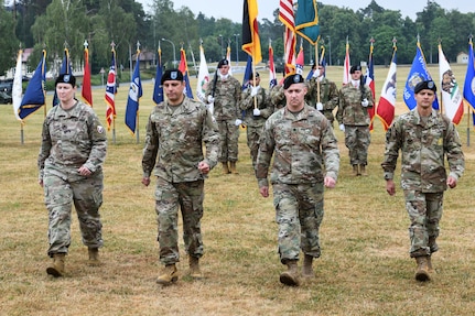 From left to right: Lt. Col. Rebecca Milkowski-Gerdelman, Col. Brad Bane, Lt. Col. Denny Bernacki and Master Sgt. Randolph Leyba march across the parade field during the Army Field Support Battalion-Germany change of command and assumption of responsibility ceremony in Grafenwoehr, Germany, June 24. (photo by Markus Rauchenberger)