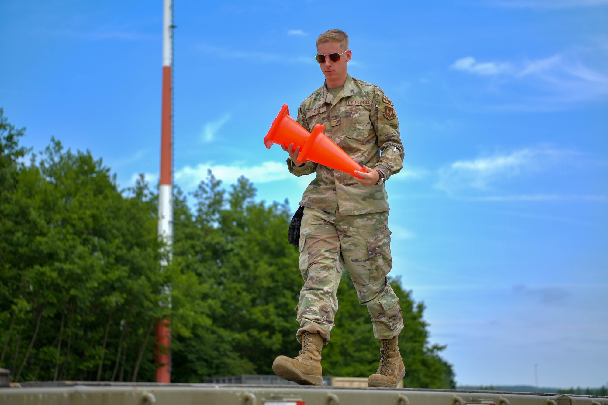 U.S. Air Force  Airman 1st Class Riston Mais, 86th Munitions Squadron conventional maintenance technician, prepares the flatbed of the 26-ton truck at Ramstein Air Base, Germany, June 21, 2022.