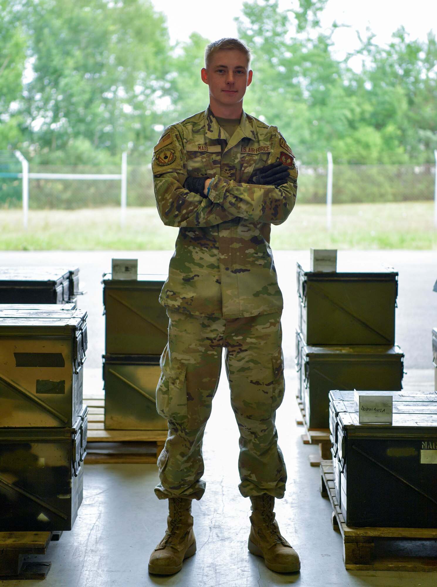 U.S. Air Force  Airman 1st Class Riston Mais, 86th Munitions Squadron conventional maintenance technician, poses for an environmental portrait in the ammo bay at Ramstein Air Base, Germany, June 22, 2022.