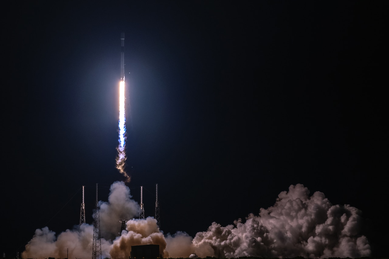 A rocket launches at night.