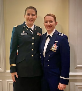 1st Lt. Nicole Albertson, at left, with her partner.