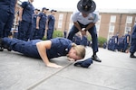 Company Commanders from Coast Guard Training Center Cape May, visit the Coast Guard Academy to train and instruct cadets on how to successfully assume the role of cadre, June 21, 2022. As cadre the cadets will be tasked with leading their swabs through seven weeks of basic military training. (U.S. Coast Guard photo by Petty Officer 3rd Class Matthew Abban)