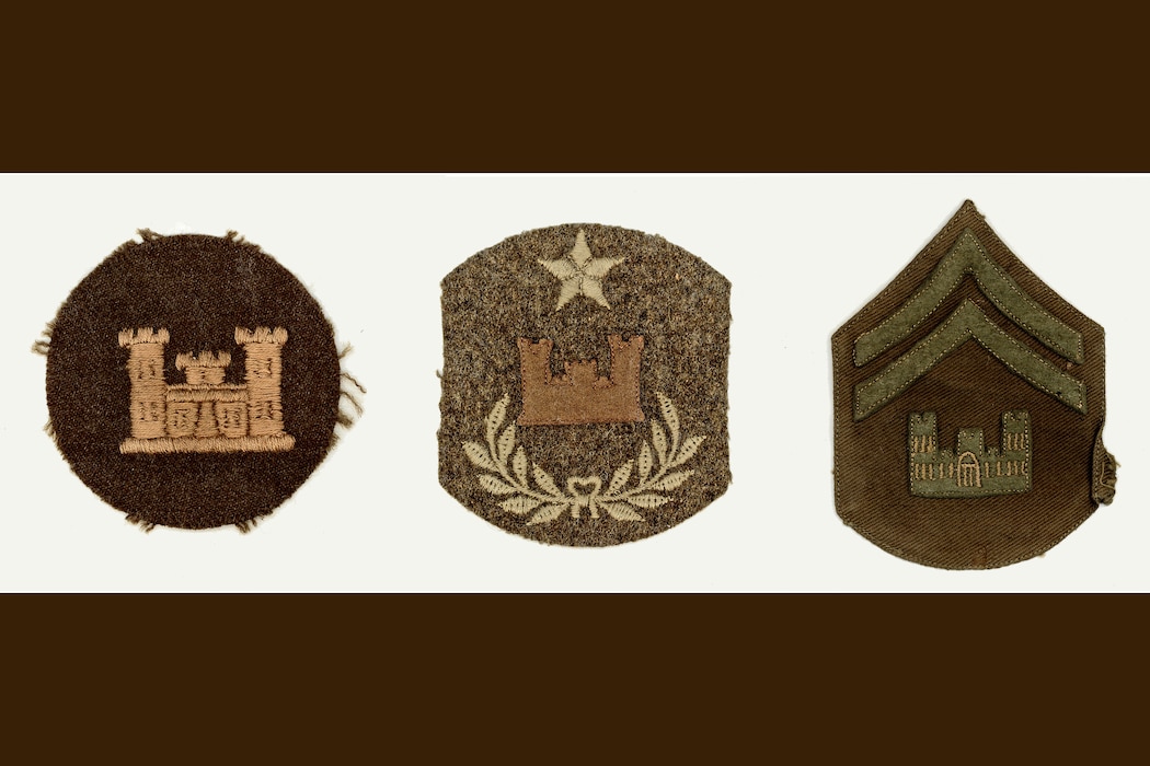 Three brown patches with castle logos