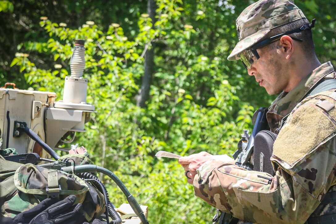 Capt. Eikoku Ikeno, a judge advocate assigned to 4th Cavalry Brigade, First Army Division East, completes signal testing as part of the requirements for the Brigade Spur Ride.