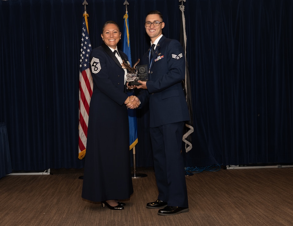 Servicemembers posing for a photo during award ceremony