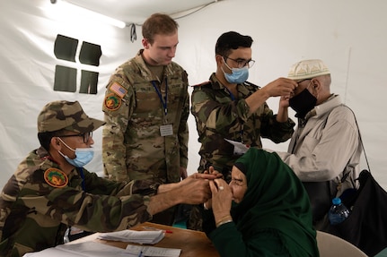 U.S. Army Spc. Blake Dalto and Royal Moroccan Army soldiers test the fit of their patients' new glasses at the Humanitarian Civic Assistance (HCA) center in Taliouine, Morocco, June 21, 2022, during African Lion 22.